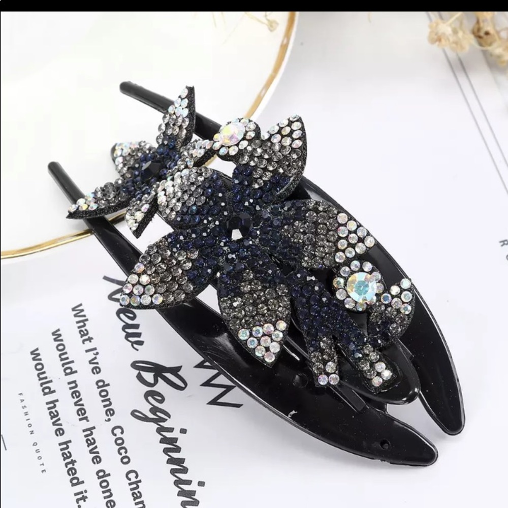 This absolutely beautiful crystal and rhinestone clip was made entirely by hand